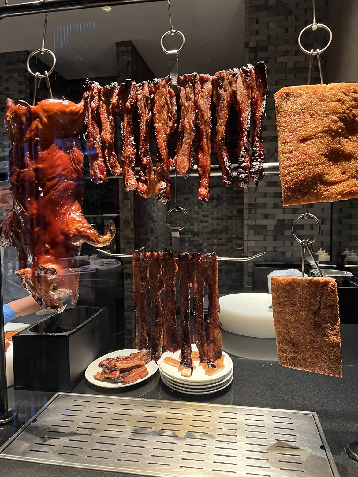 Cantonese roast meats hanging in the Yu Ting Yuan kitchen window