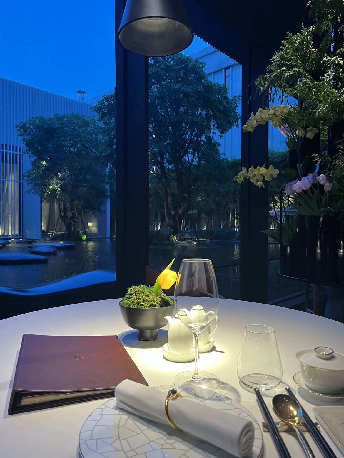 A window table at Yu Ting Yuan looking over the dusk pond