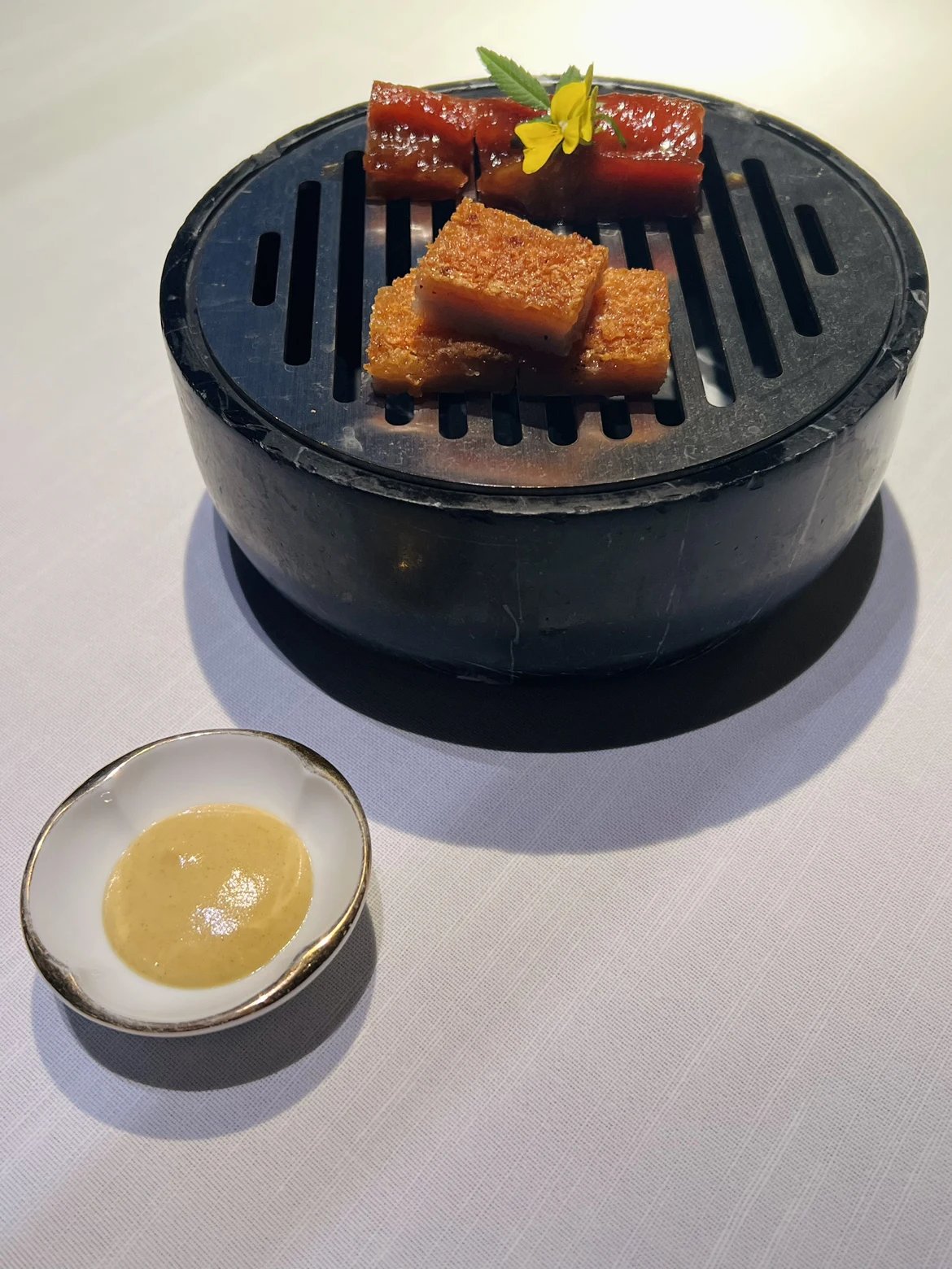 Barbecued pork on a small charcoal grill at Yu Ting Yuan