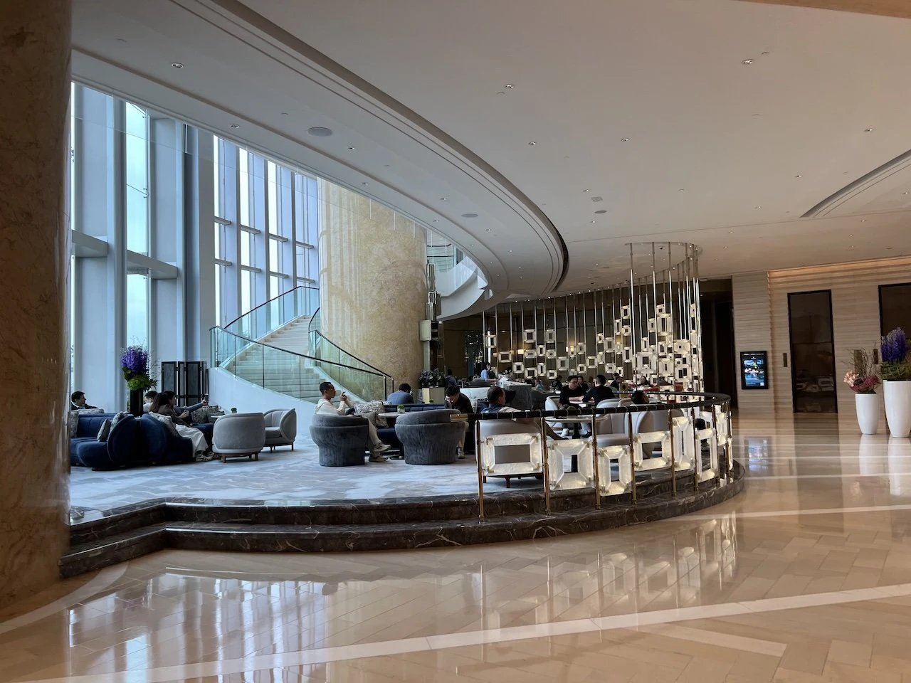 The lobby lounge with its curved bar and tall windows