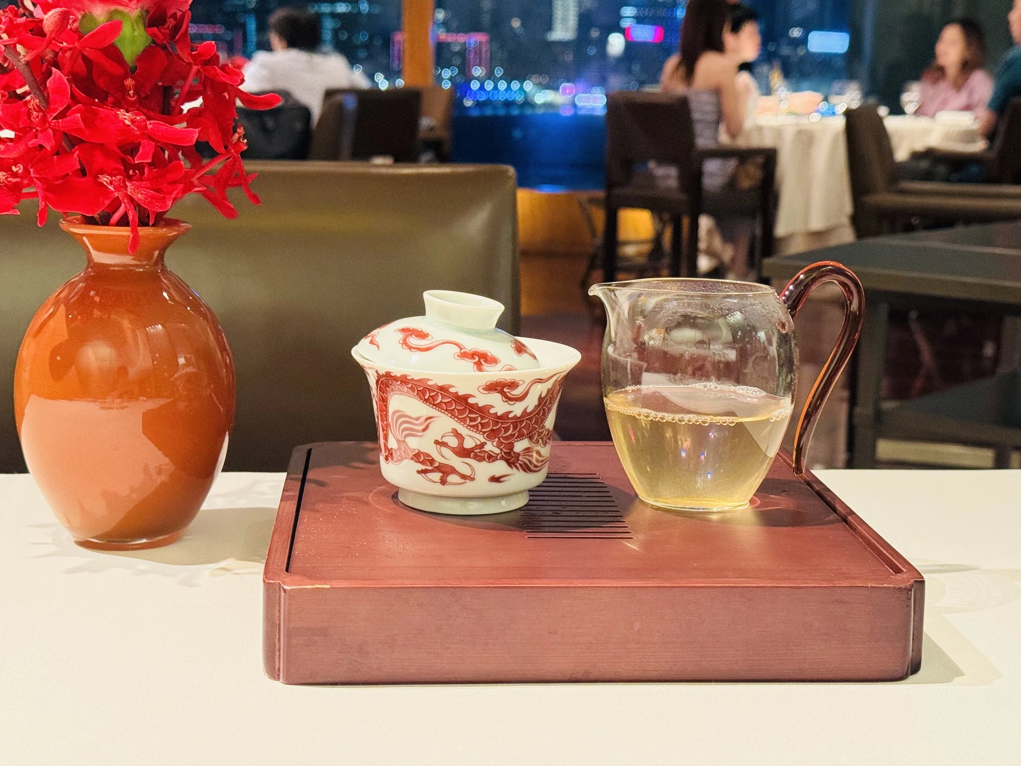 Tea service at Lung King Heen with the night skyline behind