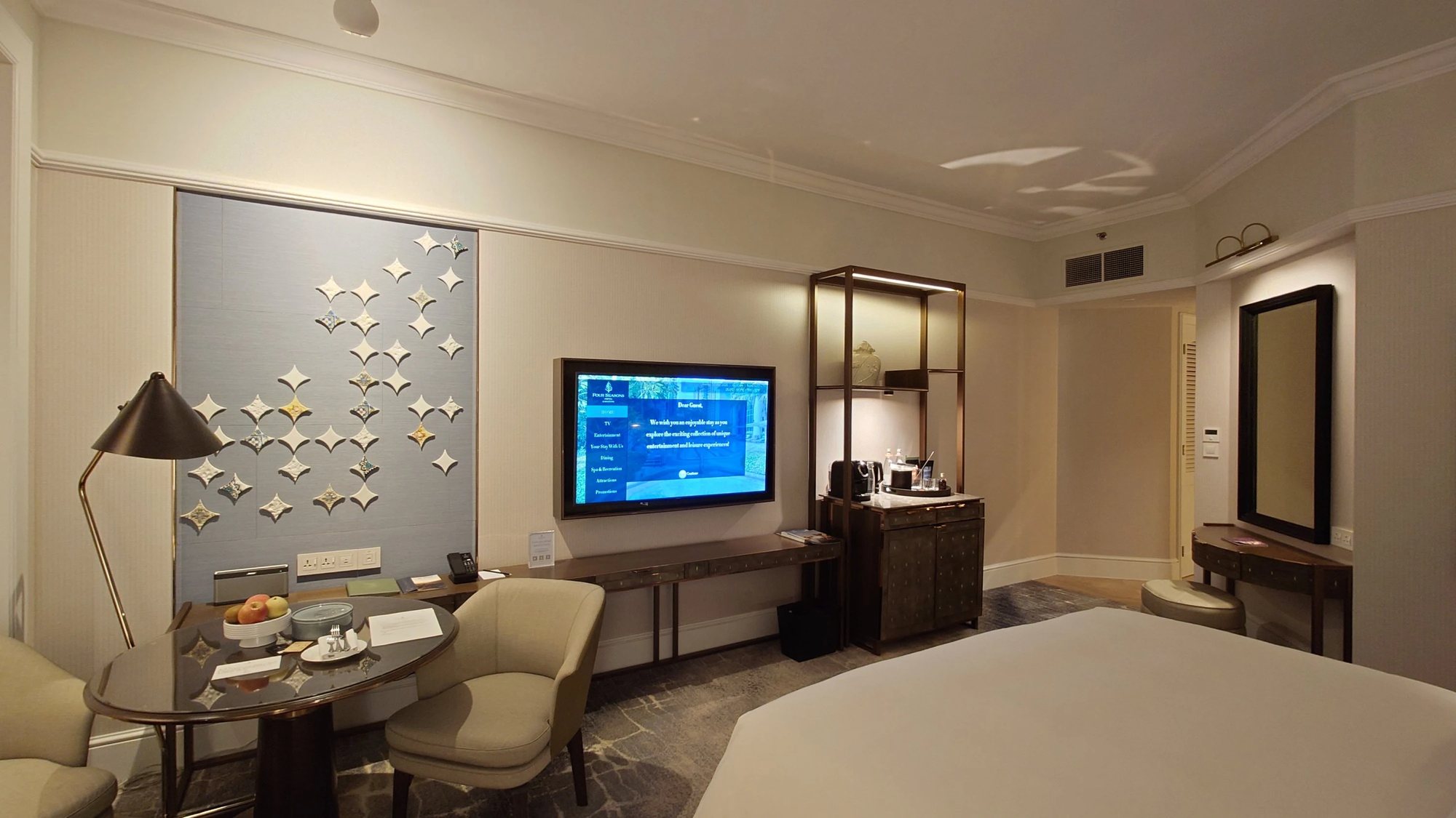 The desk and television side of a guest room