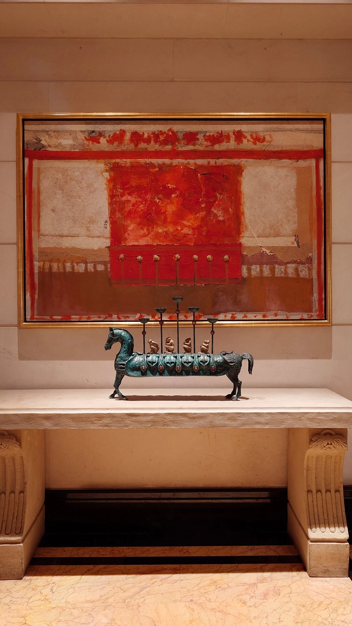 A painting and bronze horse from the hotel's art collection