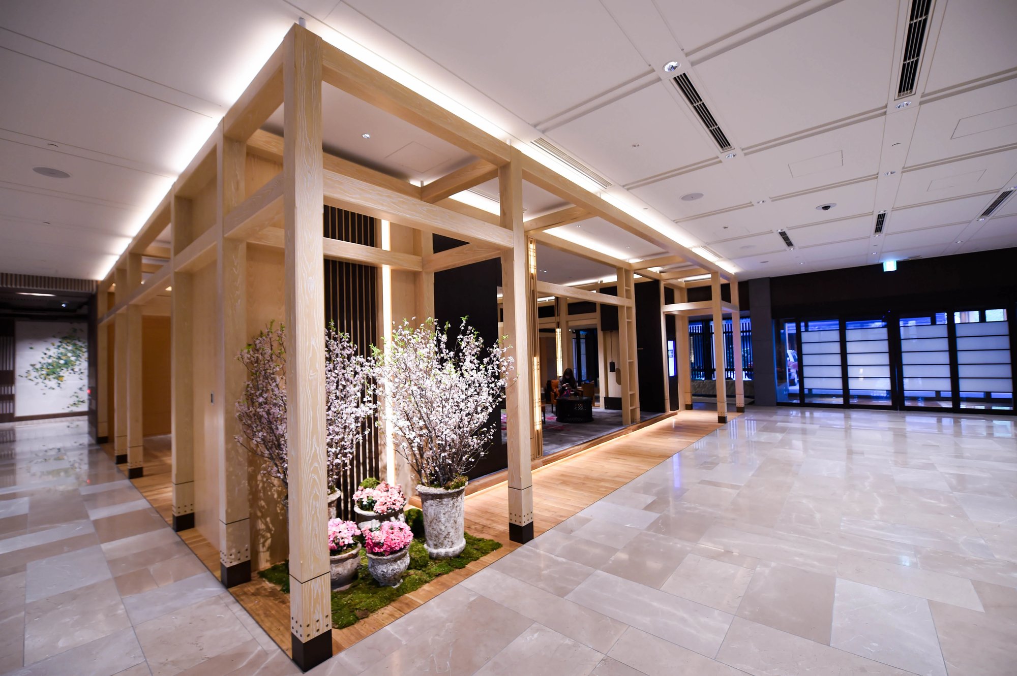 The marble lobby with its timber pavilion and cherry blossom