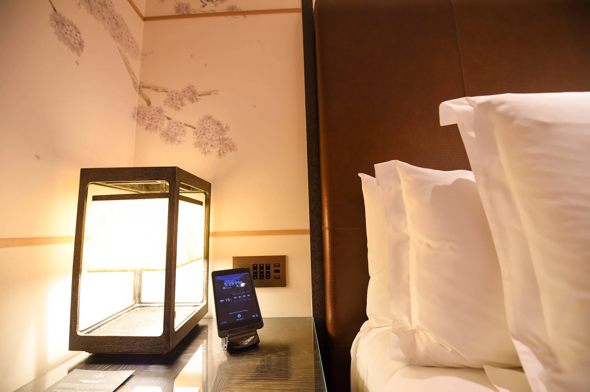 A paper lantern beside the bed