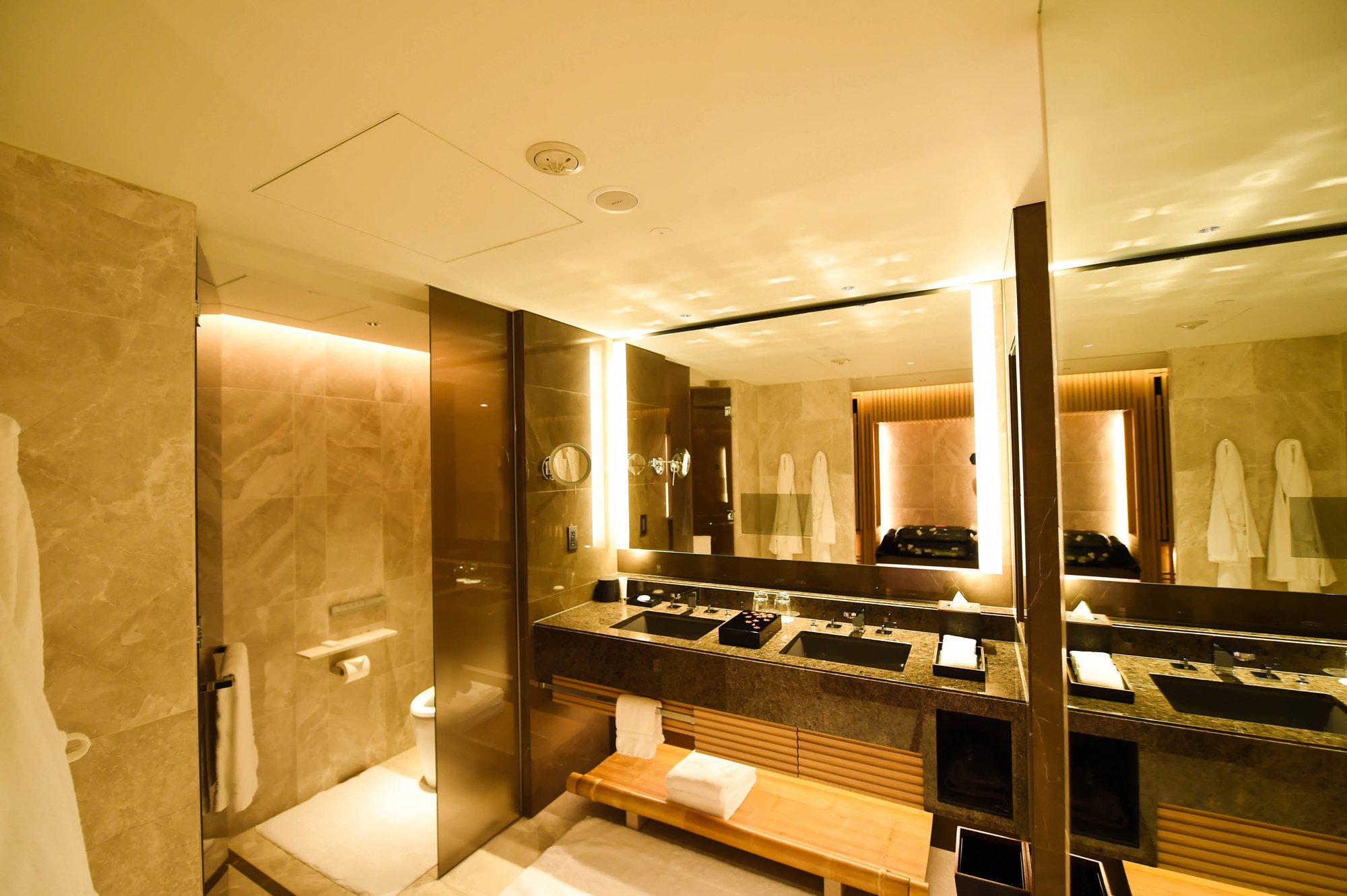 The wide bathroom with a double vanity