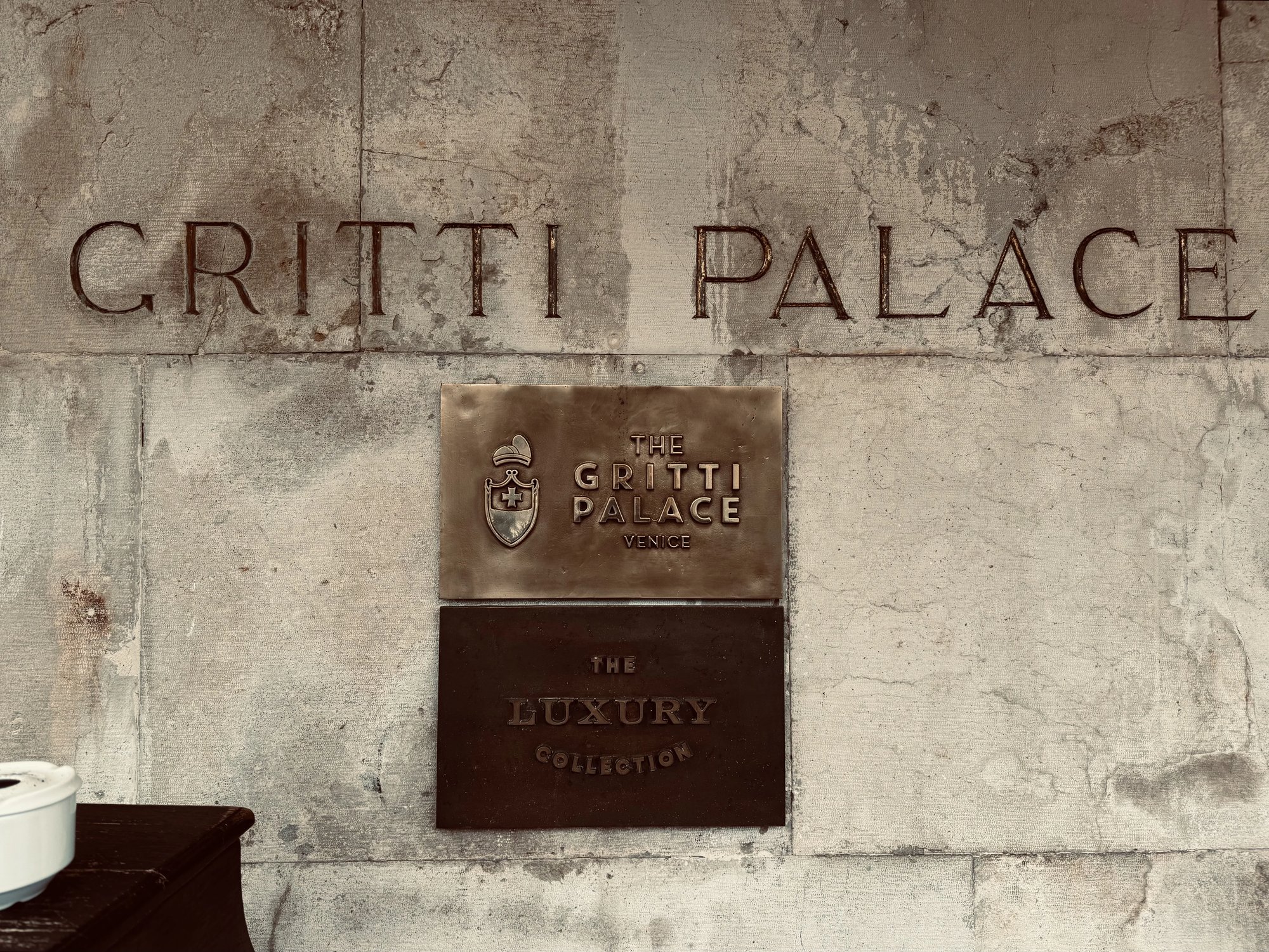 The Gritti Palace sign on the stone wall