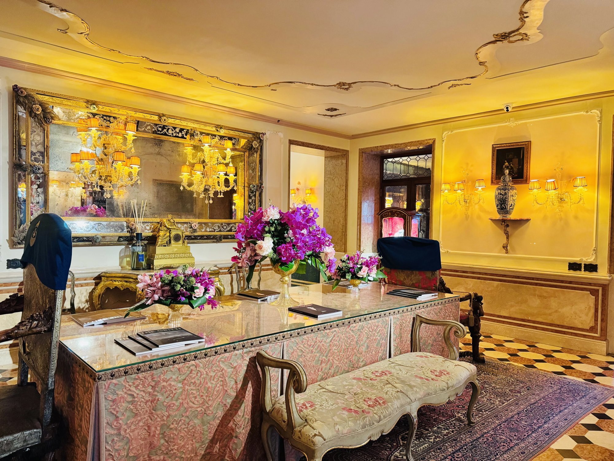 The reception hall with a gilded mirror and flowers