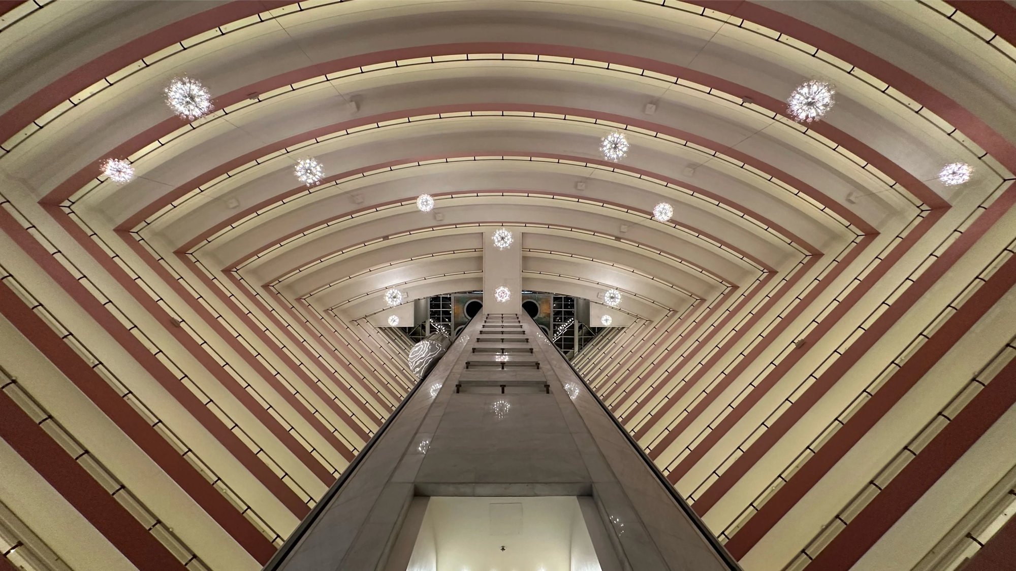 Looking up the atrium at its curved ribbed ceiling