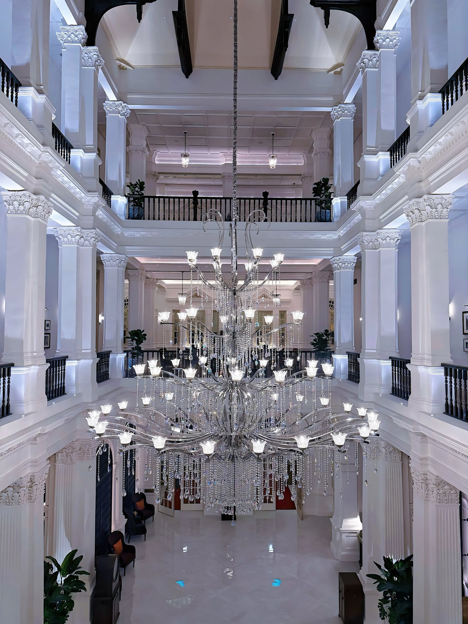 The three-storey lobby with a large glass chandelier