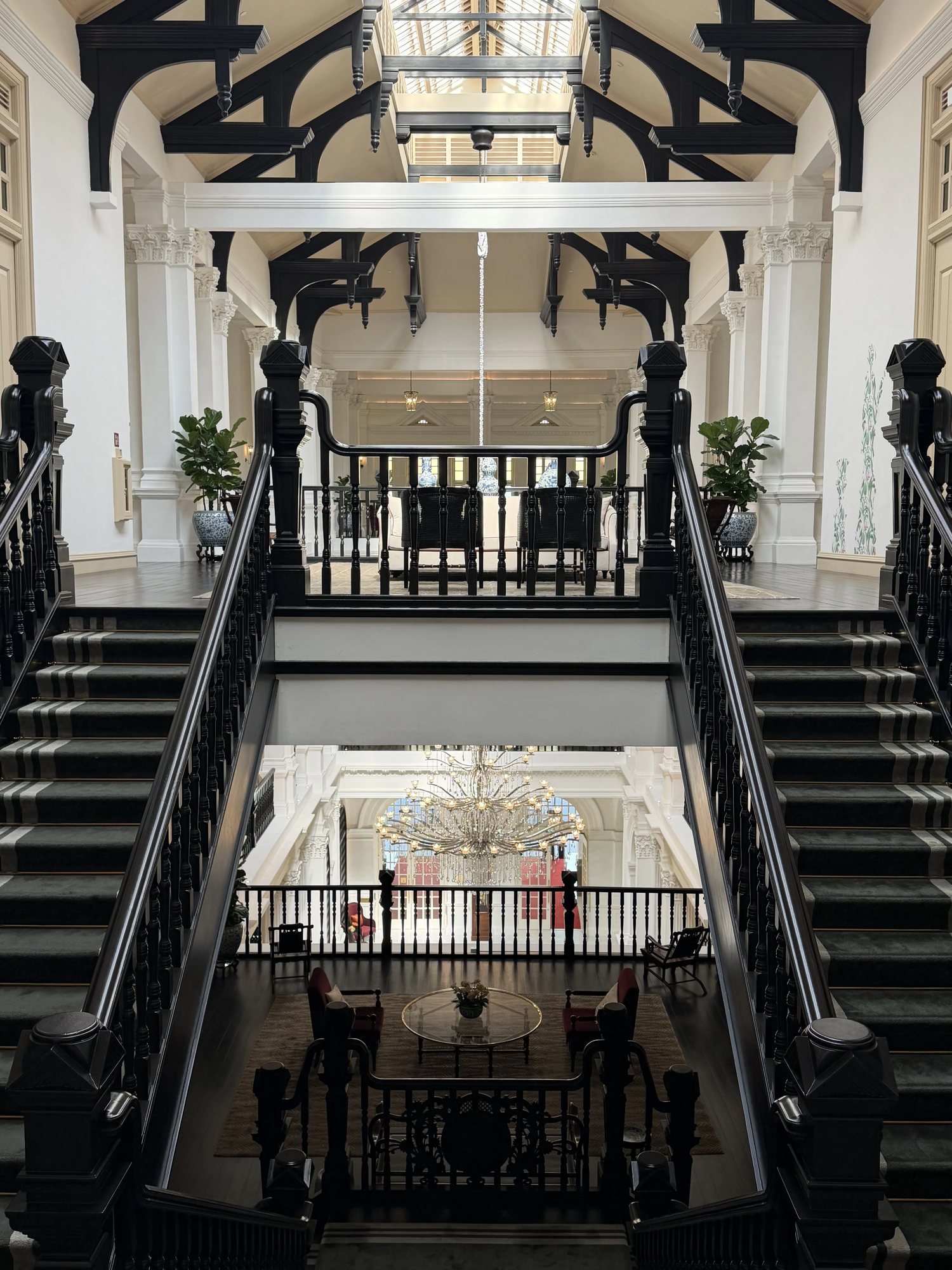The dark timber staircase above the lobby