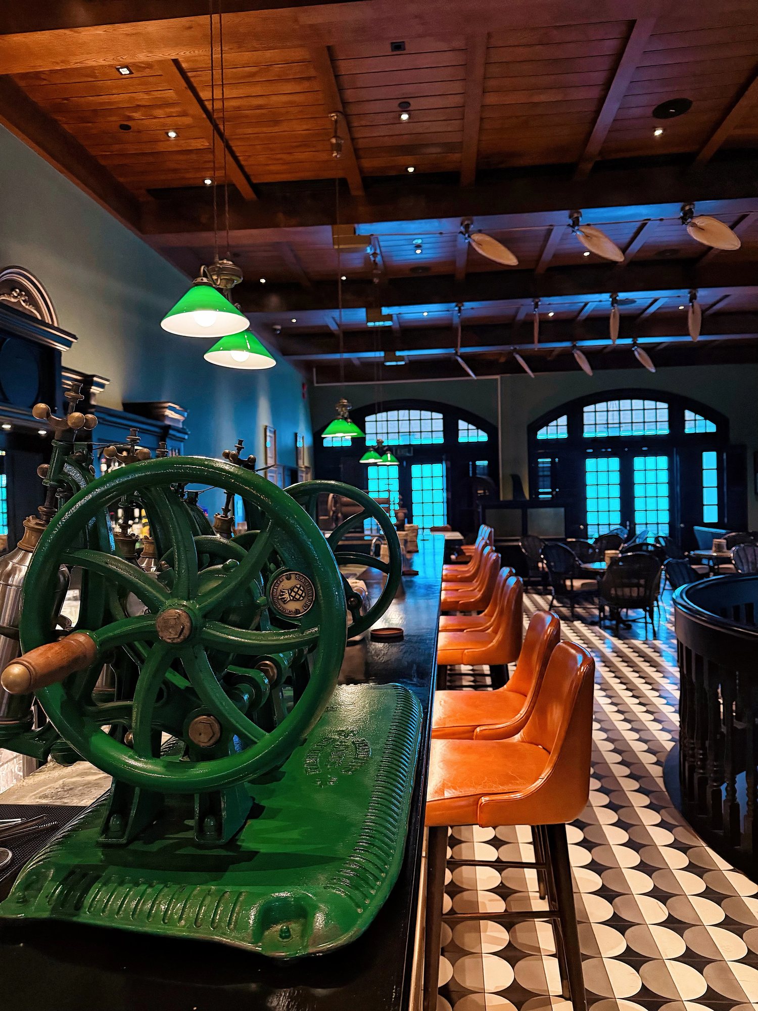 The Long Bar with its green peanut grinder and leather stools