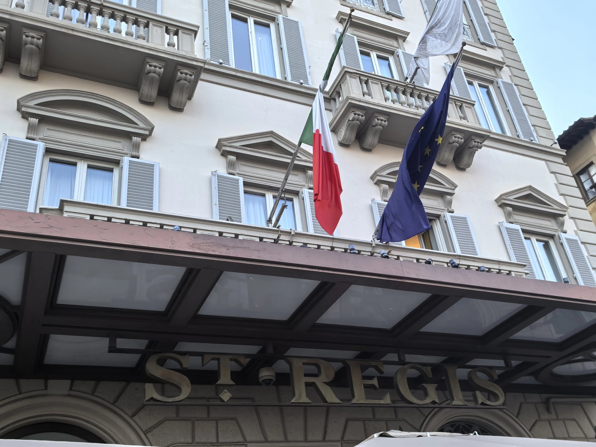 The entrance canopy with the St. Regis name and flags