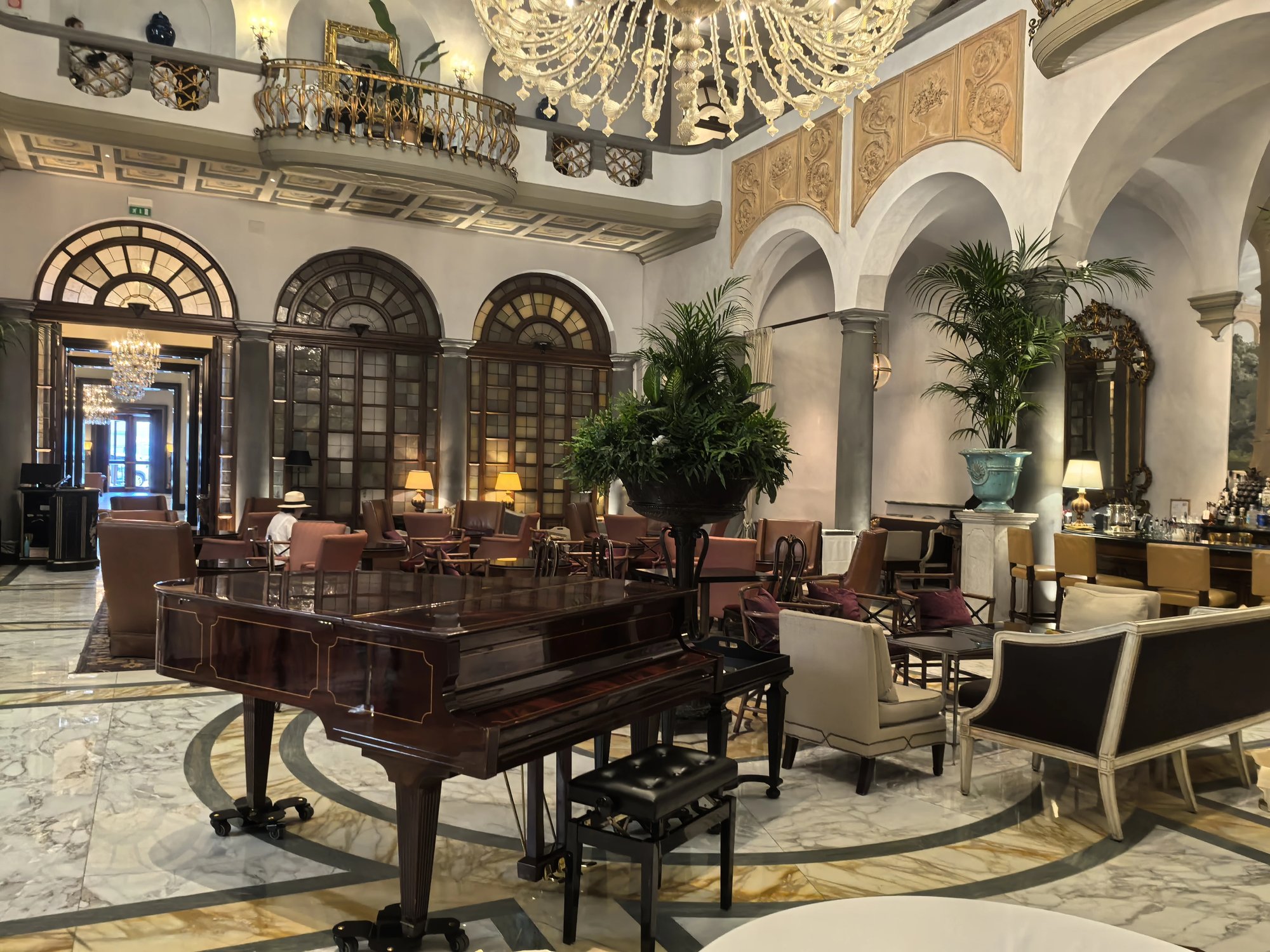 The Winter Garden atrium with a grand piano and arches