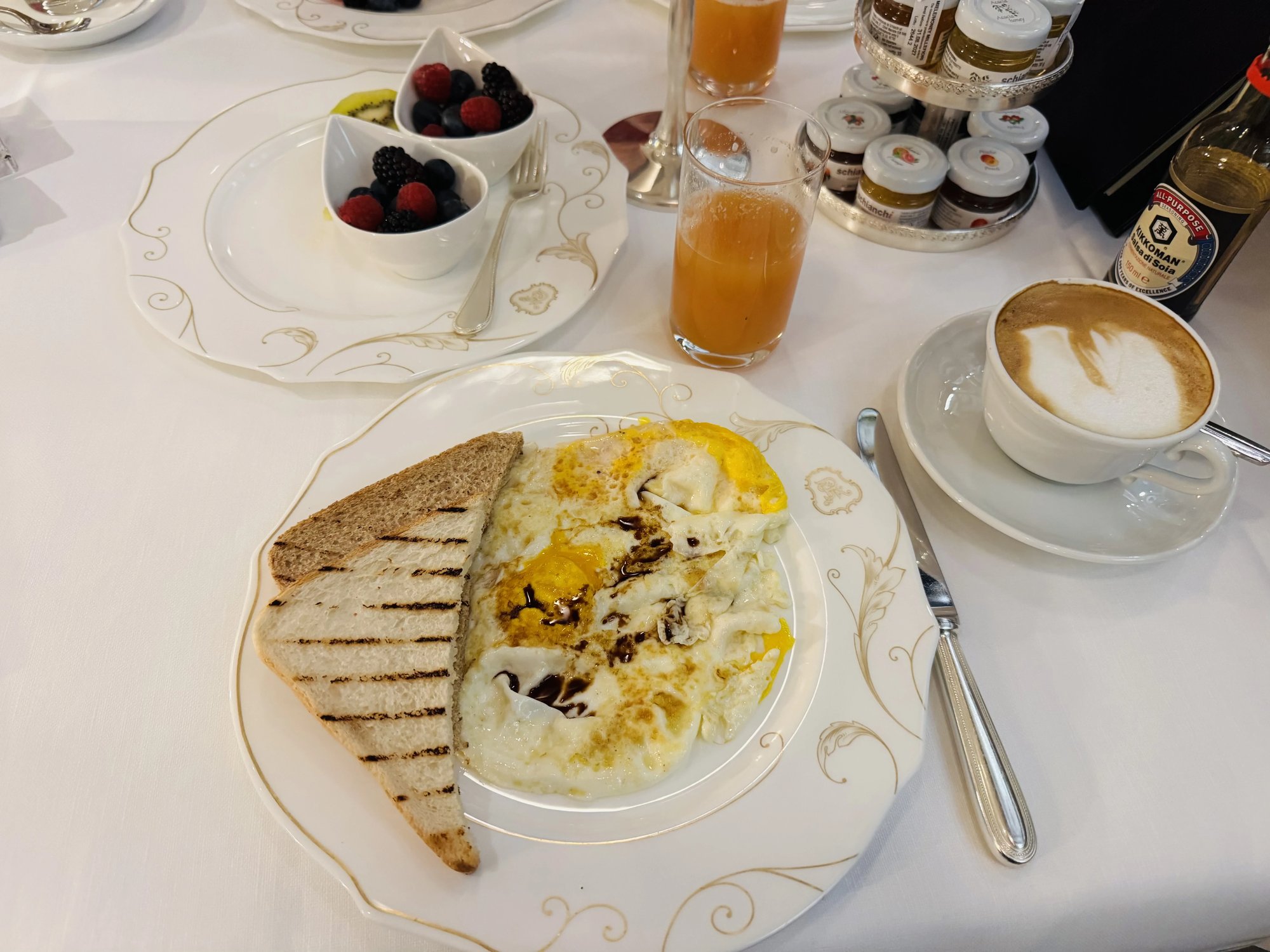 Egg dish with cappuccino and juice at breakfast