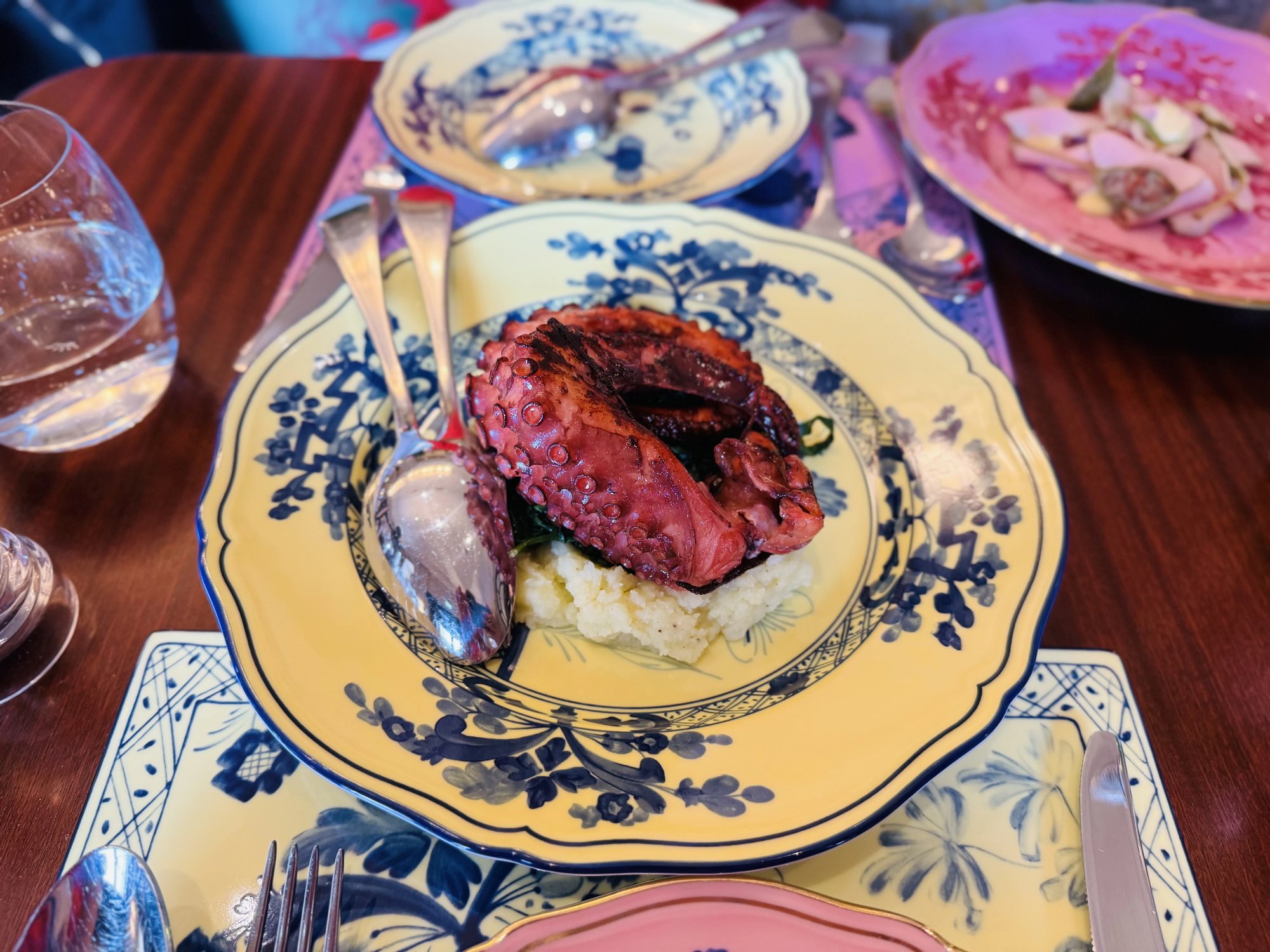 Grilled octopus on a blue-and-white Ginori plate