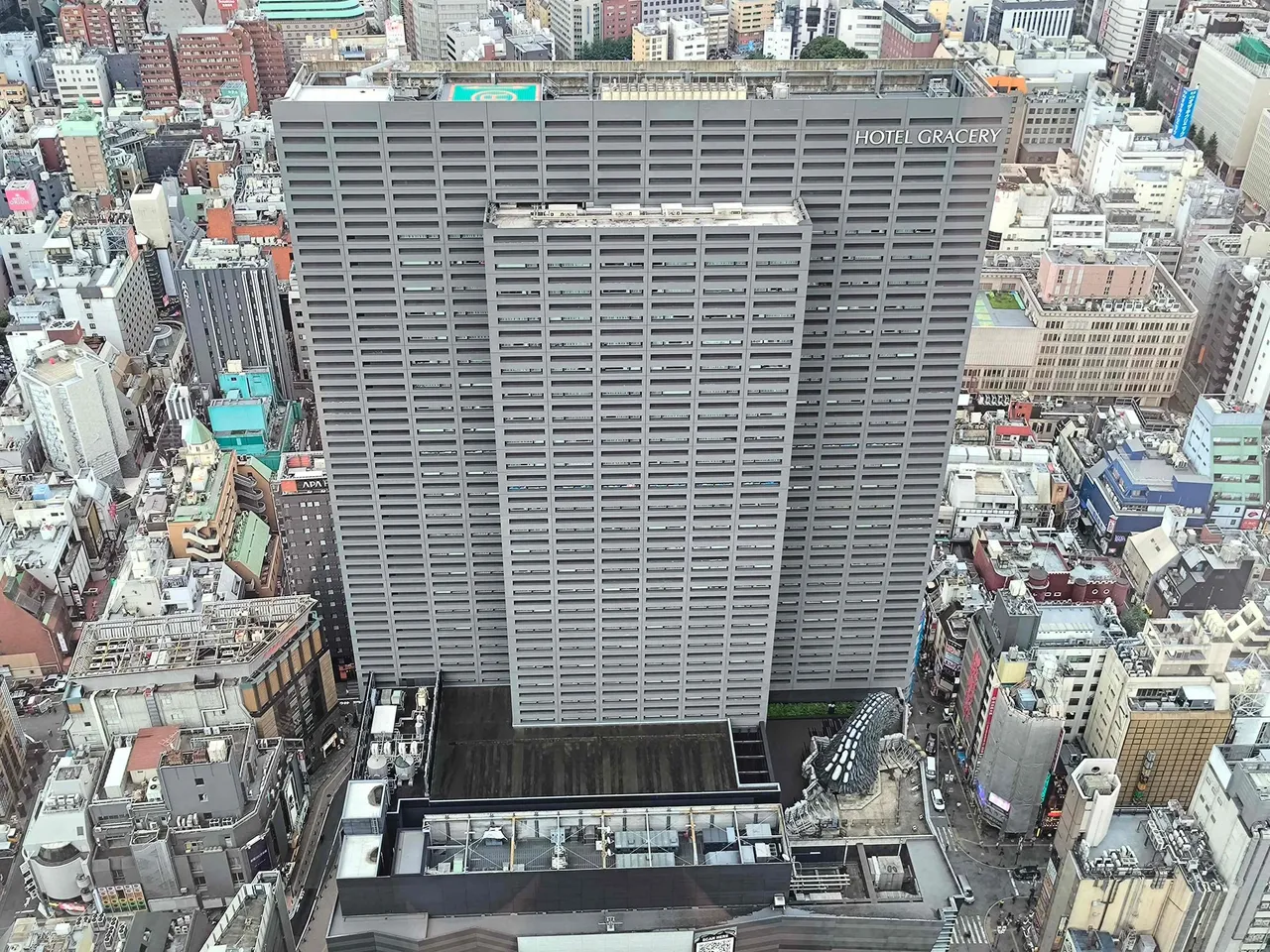 Looking straight down on the Hotel Gracery tower and Kabukicho streets by day