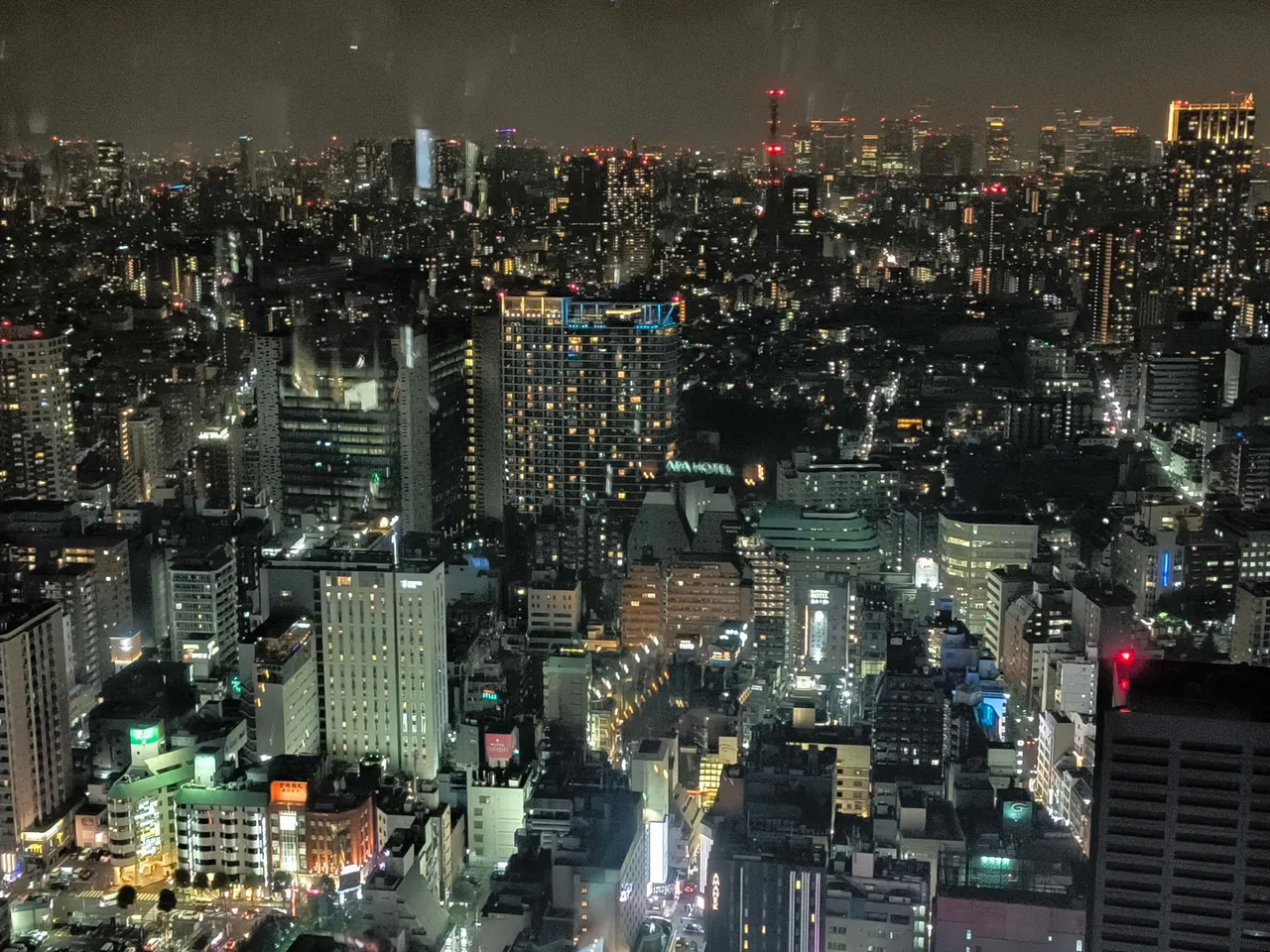 The Tokyo skyline glittering at night from a high floor