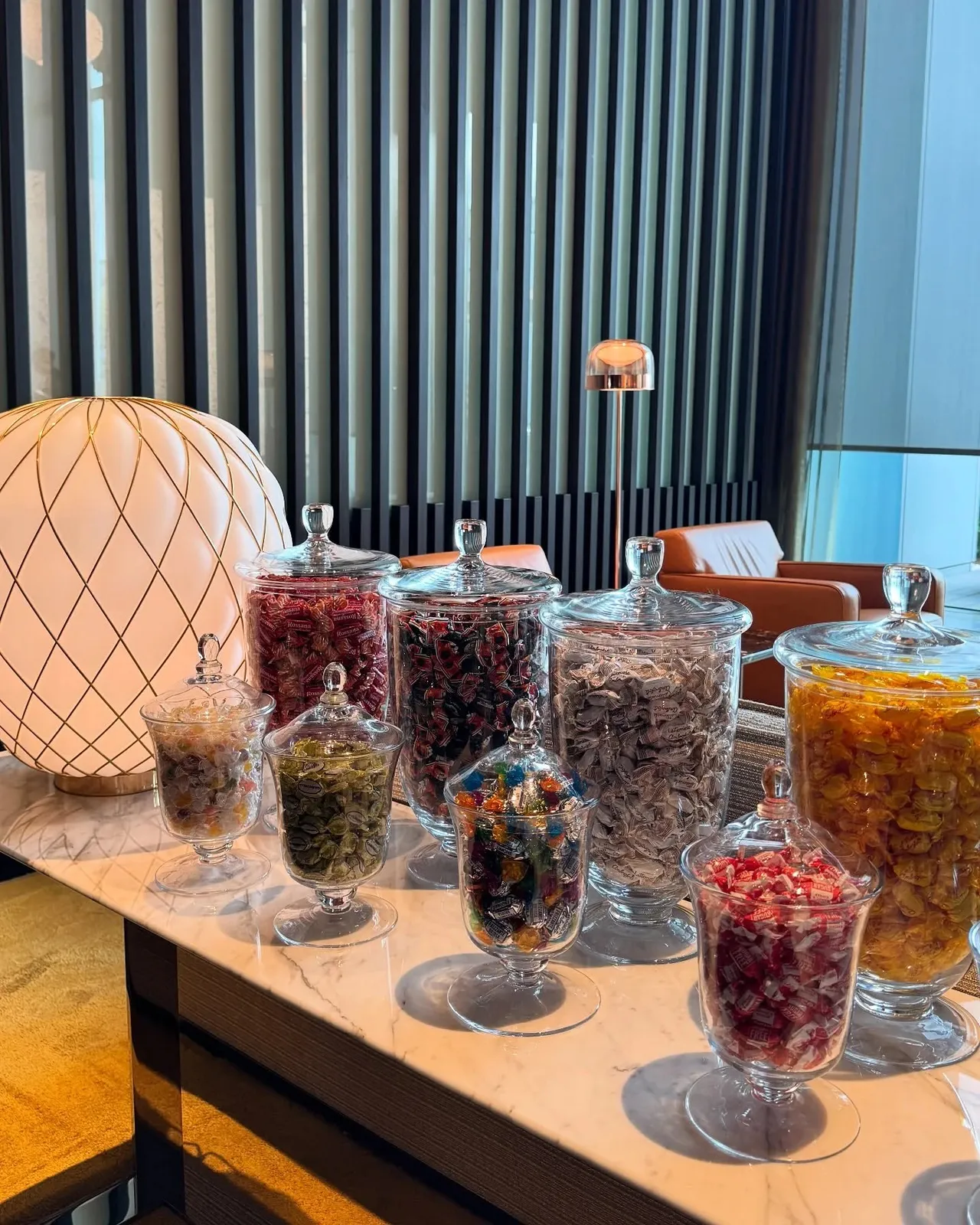 Jars of sweets on the marble table in the lounge