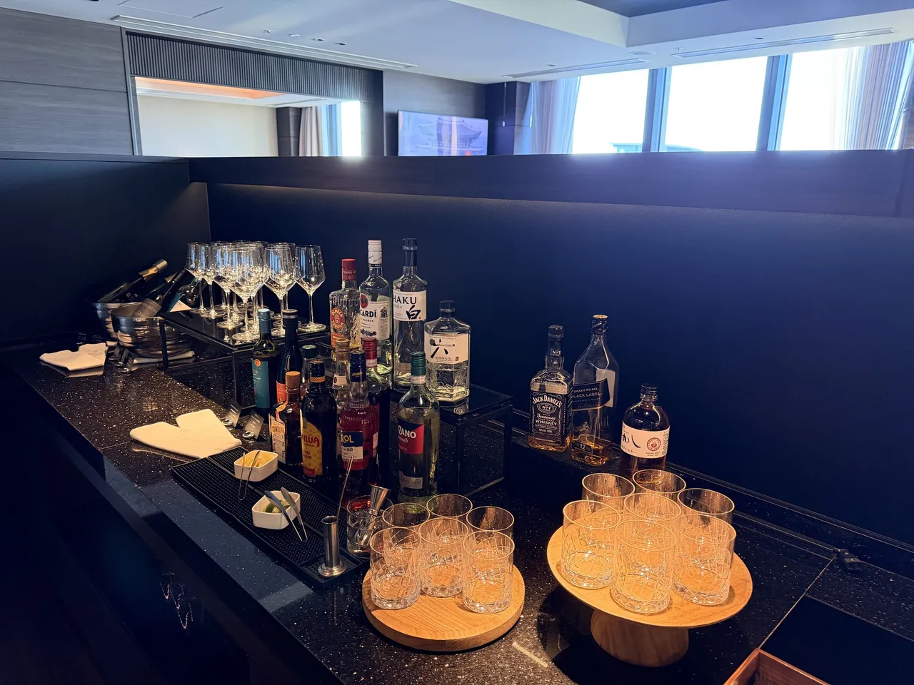 The executive lounge bar counter set with glasses, whisky and spirits