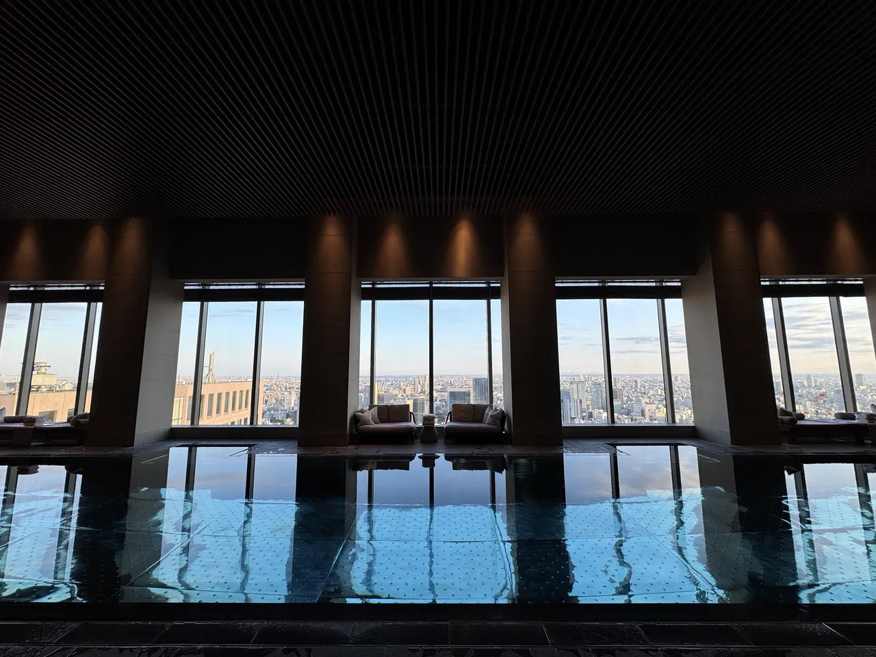 The 20-metre indoor pool and loungers along a stone wall