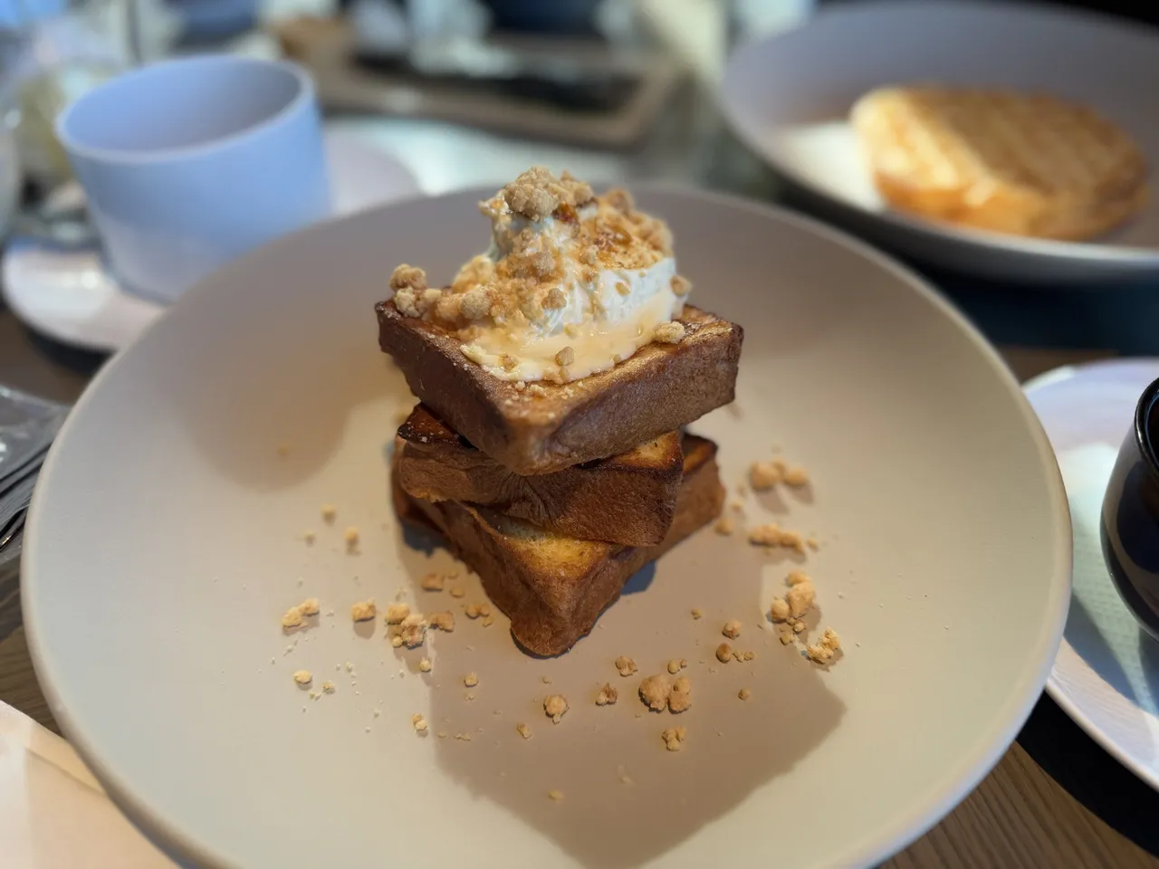 A stack of French toast with crumble