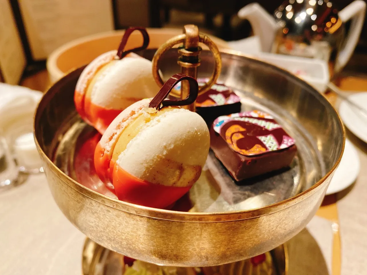 Afternoon tea sweets in a brass bowl