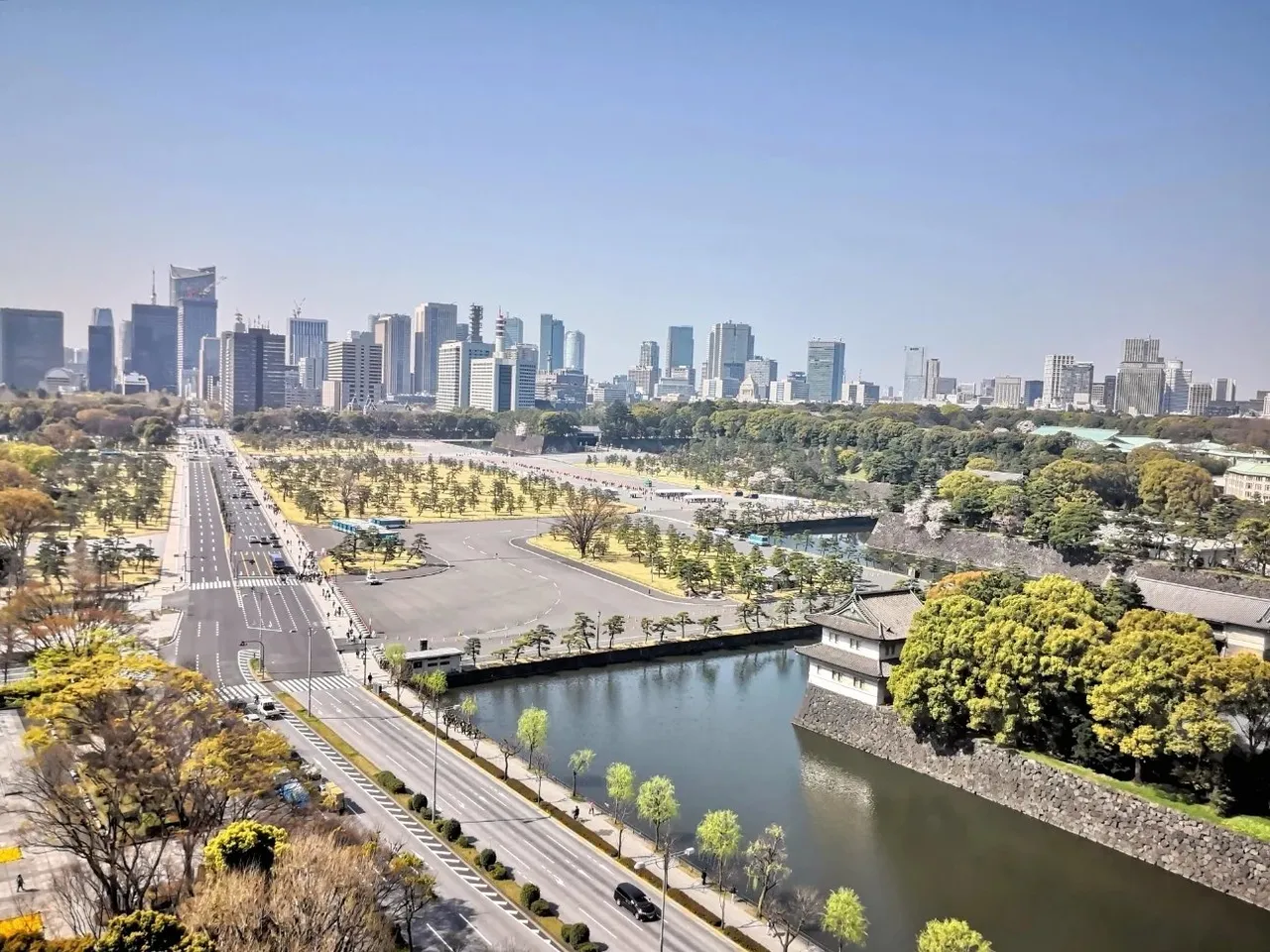 The Imperial Palace moat and stone walls with the Marunouchi towers on the skyline
