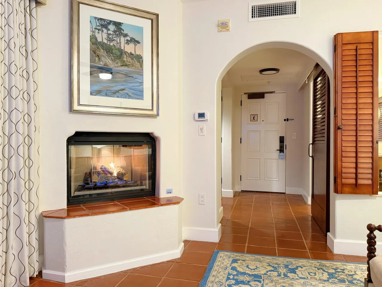 The fireplace nook beside the entry arch