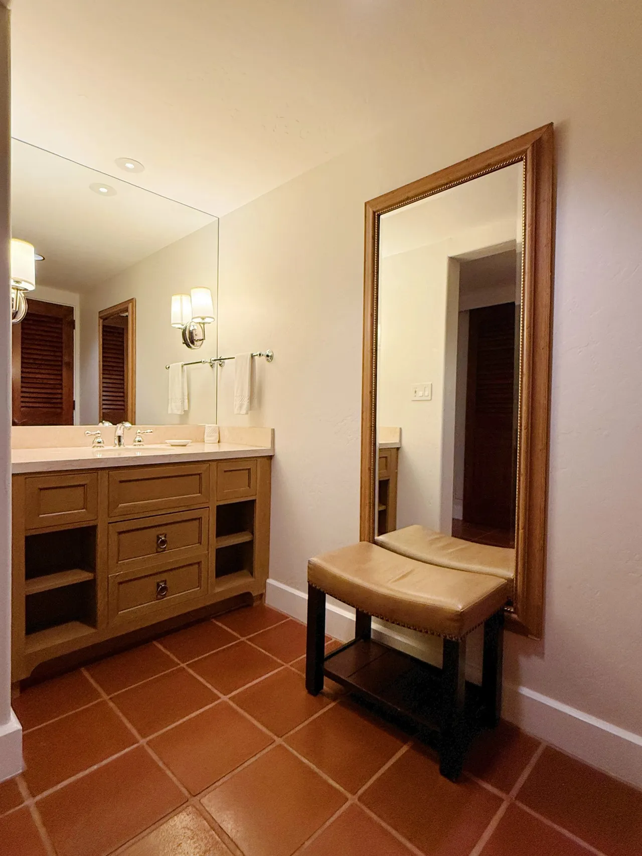 The dressing vanity with a full-length mirror