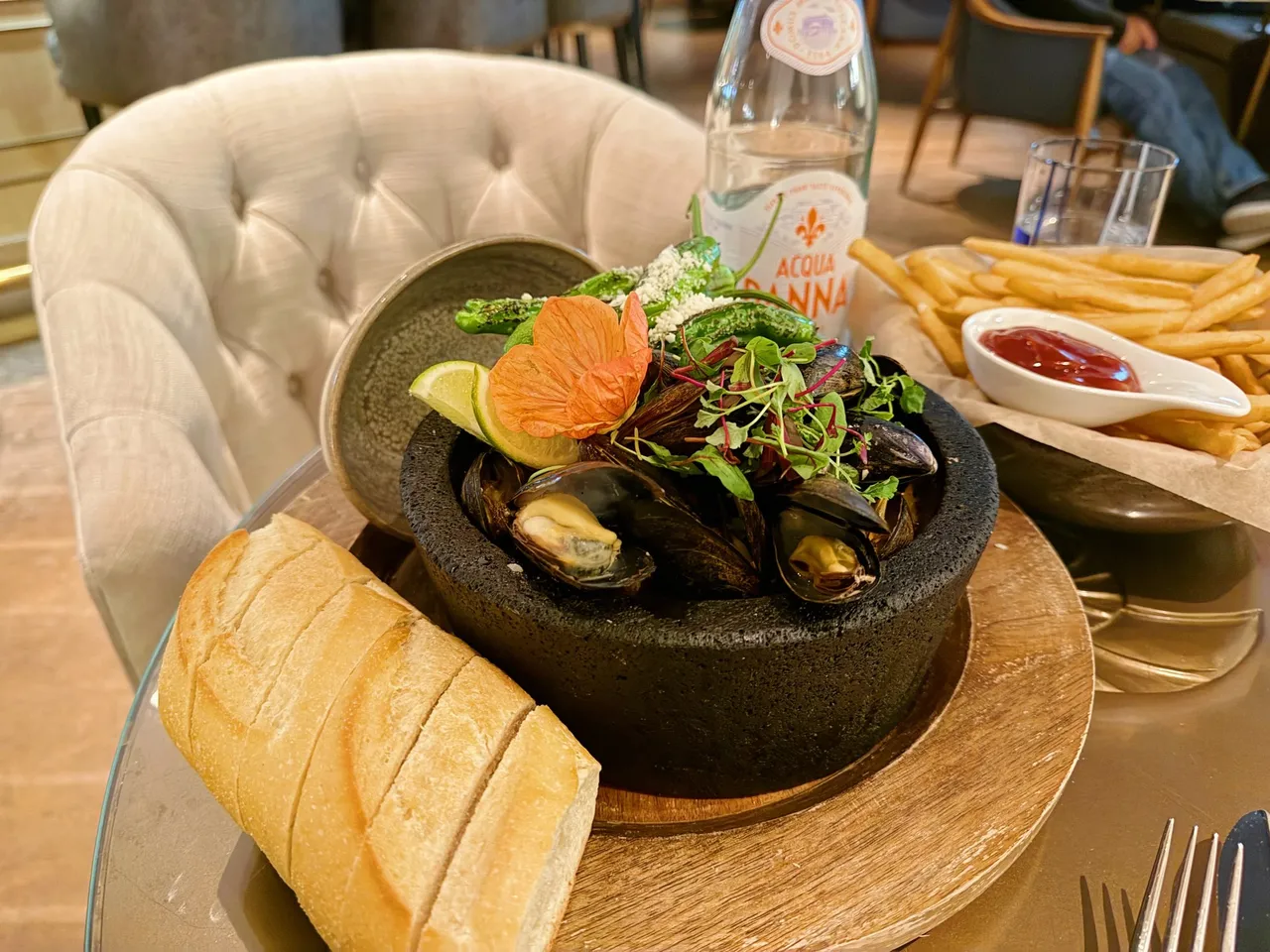 Mussels in a stone bowl with bread