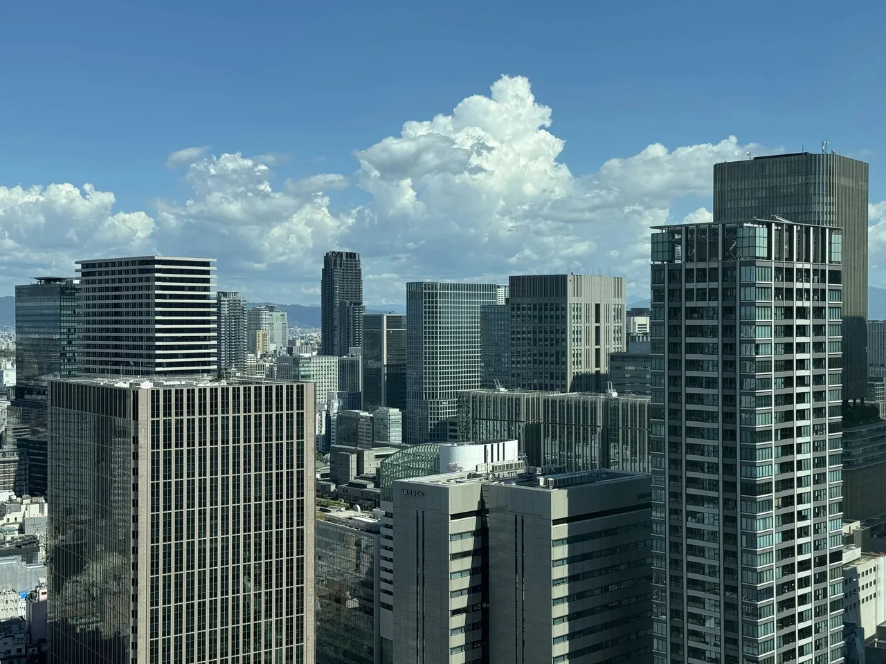 Umeda towers under summer clouds seen from the room
