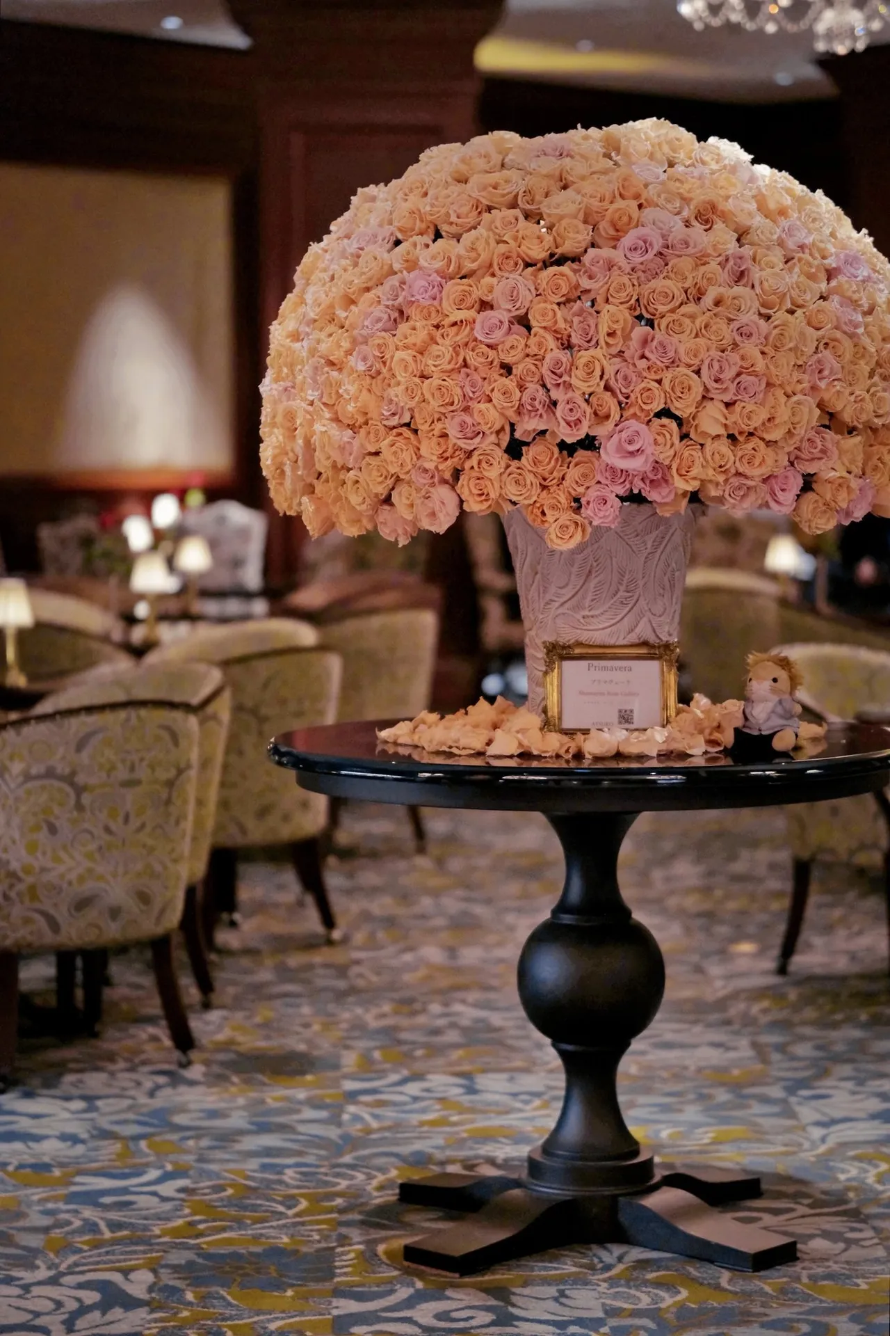 Lobby lounge with a large rose arrangement on a round table