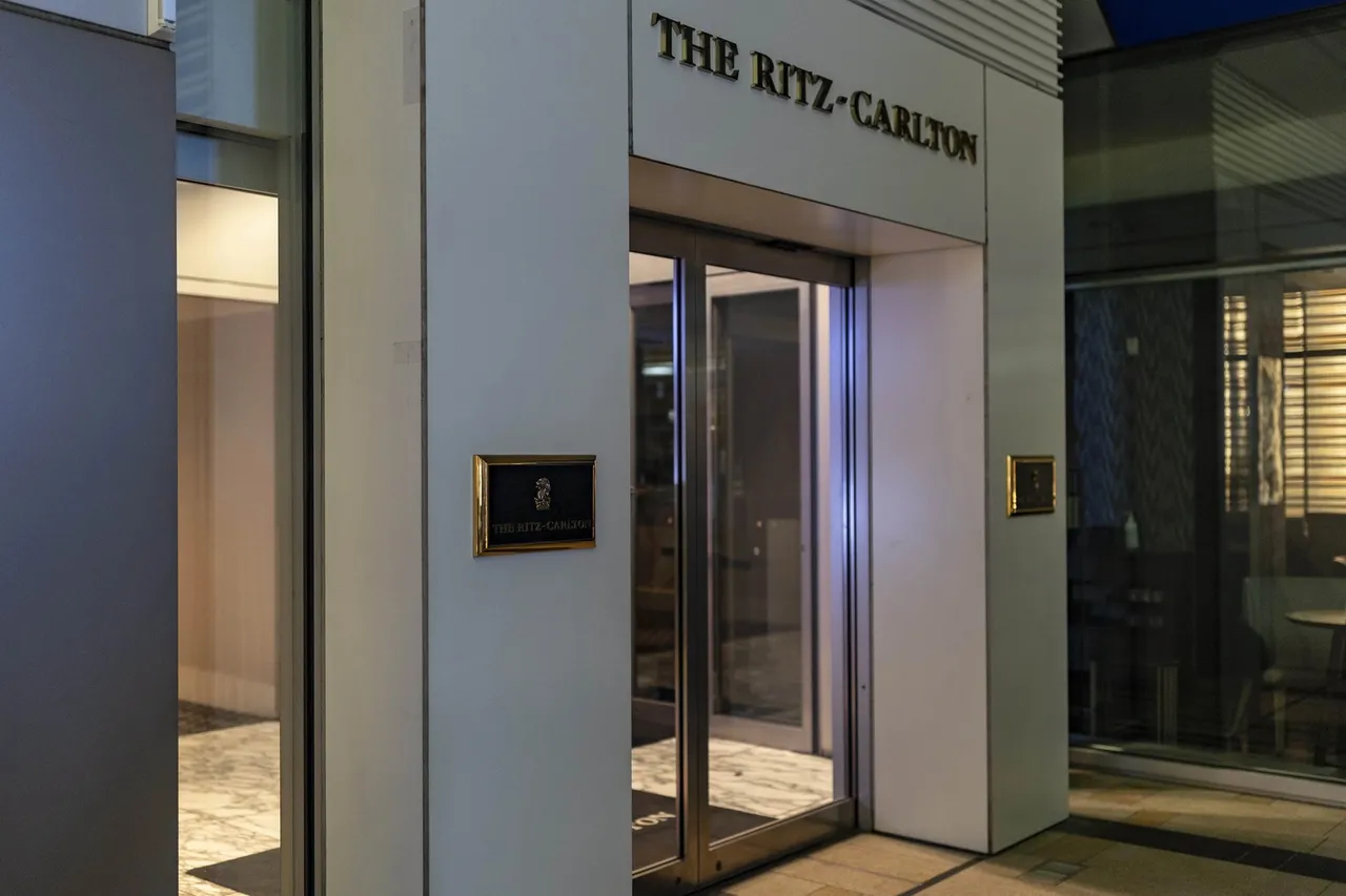 The Ritz-Carlton sign above the glass entrance doors