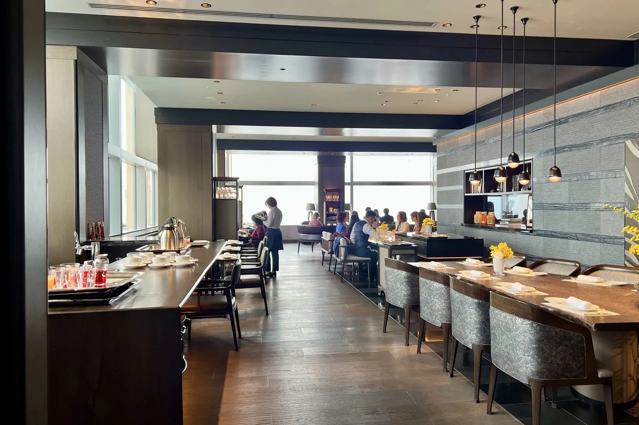The long Towers dining room with counter seating and tall windows